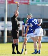 6 March 2022; Ross King of Laois receives a yellow card from referee Shane Hynes during the Allianz Hurling League Division 1 Group B match between Laois and Antrim at MW Hire O'Moore Park in Portlaoise, Laois. Photo by Michael P Ryan/Sportsfile