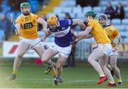 6 March 2022; Podge Delaney of Laois in action against Conor McCann, left, and Conal Cunning of Antrim during the Allianz Hurling League Division 1 Group B match between Laois and Antrim at MW Hire O'Moore Park in Portlaoise, Laois. Photo by Michael P Ryan/Sportsfile