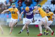 6 March 2022; Podge Delaney of Laois in action against Conor McCann, left, and Conal Cunning of Antrim during the Allianz Hurling League Division 1 Group B match between Laois and Antrim at MW Hire O'Moore Park in Portlaoise, Laois. Photo by Michael P Ryan/Sportsfile