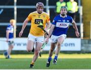 6 March 2022; Eoghan Campbell of Antrim in action against Willie Dunphy of Laois during the Allianz Hurling League Division 1 Group B match between Laois and Antrim at MW Hire O'Moore Park in Portlaoise, Laois. Photo by Michael P Ryan/Sportsfile