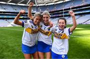 6 March 2022; St Rynagh's players, from left, Róisín Egan, Meadbh Doorley, and Sinéad Hanamy celebrate after their side's victory in the 2021 AIB All-Ireland Intermediate Camogie Club Championship Final match between Salthill Knocknacarra, Galway, and St Rynagh's, Offaly, at Croke Park in Dublin. Photo by Piaras Ó Mídheach/Sportsfile