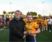 8 March 2022; LGFA member Con Moynihan presents the player of the match trophy to Sarah Clarke of DCU after the Yoplait LGFA Donaghy Cup Final match between DCU Dóchas Éireann, Dublin, and Marino Institute of Education, Dublin, at DCU Dóchas Éireann Astro Pitch in Dublin. Photo by David Fitzgerald/Sportsfile