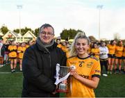 8 March 2022; LGFA member Con Moynihan presents the cup to DCU captain Loren Doyle after the Yoplait LGFA Donaghy Cup Final match between DCU Dóchas Éireann, Dublin, and Marino Institute of Education, Dublin, at DCU Dóchas Éireann Astro Pitch in Dublin. Photo by David Fitzgerald/Sportsfile