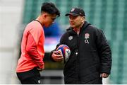 11 March 2022; England head coach Eddie Jones speaks to Marcus Smith during England captain's run at Twickenham Stadium in London, England. Photo by Brendan Moran/Sportsfile