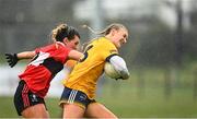11 March 2022; Emma Morrissey of DCU Dóchas Éireann in action against Rosie Corkery of UCC during the Yoplait LGFA O'Connor Cup Semi-Final match between DCU Dóchas Éireann, Dublin and UCC, Cork at DCU in Dublin. Photo by Eóin Noonan/Sportsfile