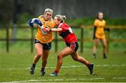 11 March 2022; Orlagh Lally of DCU Dóchas Éireann in action against Ciara McCarthy of UCC during the Yoplait LGFA O'Connor Cup Semi-Final match between DCU Dóchas Éireann, Dublin and UCC, Cork at DCU in Dublin. Photo by Eóin Noonan/Sportsfile