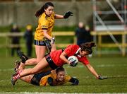 11 March 2022; Ellie Jack of UCC is tackled by Jennifer Duffy of DCU Dóchas Éireann during the Yoplait LGFA O'Connor Cup Semi-Final match between DCU Dóchas Éireann, Dublin and UCC, Cork at DCU in Dublin. Photo by Eóin Noonan/Sportsfile