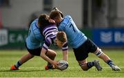 11 March 2022; Will O'Leary of Terenure College is tackled by Harry Miller and Myles Berman of St Michaels College during the Bank of Ireland Leinster Schools Junior Cup 2nd Round match between Terenure College and St Michaels College at Energia Park in Dublin. Photo by Harry Murphy/Sportsfile