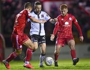11 March 2022; Keith Ward of Dundalk in action against John Ross Wilson, left, and Aodh Dervin of Shelbourne during the SSE Airtricity League Premier Division match between Shelbourne and Dundalk at Tolka Park in Dublin. Photo by Eóin Noonan/Sportsfile