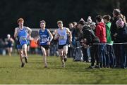 12 March 2022; Lughaigh Mallon of Rathmore Grammar School, Belfast, left, Peter Farrell of St Flannans Ennis, Clare, centre, and Sean Lawton of Colaiste Pobail Bantry, Cork, race for the finish line in the intermediate boys 5000m during the Irish Life Health All-Ireland Schools Cross Country at the City of Belfast Mallusk Playing Fields in Belfast. Photo by Ramsey Cardy/Sportsfile