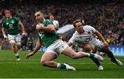 12 March 2022; James Lowe of Ireland scores his side's first try despite the tackle of Max Malins of England during the Guinness Six Nations Rugby Championship match between England and Ireland at Twickenham Stadium in London, England. Photo by David Fitzgerald/Sportsfile