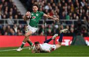 12 March 2022; Hugo Keenan of Ireland gets past the tackle Freddie Steward of England during the Guinness Six Nations Rugby Championship match between England and Ireland at Twickenham Stadium in London, England. Photo by Brendan Moran/Sportsfile