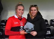 12 March 2022; Katie Quirke of UCC receives the Player of the Match award from Deirdre Lowry, Brand Manager, Yoplait Ireland, after the Yoplait LGFA O'Connor Cup Final match between UCC and UL at DCU in Dublin. Photo by Eóin Noonan/Sportsfile