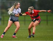 12 March 2022; Ciara Needham of UL in action against Emma Cleary of UCC during the Yoplait LGFA O'Connor Cup Final match between UCC and UL at DCU in Dublin. Photo by Eóin Noonan/Sportsfile