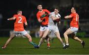 12 March 2022; Daniel Flynn of Kildare in action against Armagh players, from left, Greg McCabe, Ciaron O'Hanlon and James Morgan during the Allianz Football League Division 1 match between Armagh and Kildare at the Athletic Grounds in Armagh. Photo by Piaras Ó Mídheach/Sportsfile