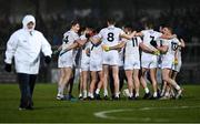 12 March 2022; Kildare players in a huddle, as an umpire makes his way to his position, before the Allianz Football League Division 1 match between Armagh and Kildare at the Athletic Grounds in Armagh. Photo by Piaras Ó Mídheach/Sportsfile