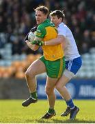 13 March 2022; Jason McGee of Donegal is tackled by Darren Hughes of Monaghan during the Allianz Football League Division 1 match between Donegal and Monaghan at MacCumhaill Park in Ballybofey, Donegal. Photo by Ramsey Cardy/Sportsfile