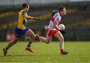 13 March 2022; Ethan Doherty of Derry in action against Ultan Harney of Roscommon during the Allianz Football League Division 2 match between Roscommon and Derry at Dr Hyde Park in Roscommon. Photo by Piaras Ó Mídheach/Sportsfile