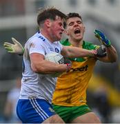 13 March 2022; Andrew Woods of Monaghan is tackled by Ódhran McFadden Ferry of Donegal during the Allianz Football League Division 1 match between Donegal and Monaghan at MacCumhaill Park in Ballybofey, Donegal. Photo by Ramsey Cardy/Sportsfile