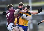 13 March 2022; Ciaran Russell of Clare in action against Jack Glynn, left, and Mathew Tierney of Galway during the Allianz Football League Division 2 match between Galway and Clare at Tuam Stadium in Tuam, Galway. Photo by Ray Ryan/Sportsfile