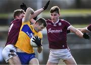 13 March 2022; Ciaran Russell of Clare in action against Jack Glynn, left, and Mathew Tierney of Galway during the Allianz Football League Division 2 match between Galway and Clare at Tuam Stadium in Tuam, Galway. Photo by Ray Ryan/Sportsfile