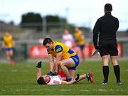 13 March 2022; Brian Stack of Roscommon and Shane McGuigan of Derry tussle off the ball late in the second half, as linesman David Gough watches, during the Allianz Football League Division 2 match between Roscommon and Derry at Dr Hyde Park in Roscommon. Photo by Piaras Ó Mídheach/Sportsfile