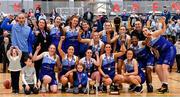 13 March 2022; The Address UCC Glanmire players celebrate with the trophy after the MissQuote.ie SuperLeague match between The Address UCC Glanmire and Trinity Meteors at Mardyke Arena in Cork. Photo by Eóin Noonan/Sportsfile