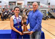 13 March 2022; The Address UCC Glanmire captain Aine McKenna is presented with the trophy by chairman of the ladies basketball board John Ferris after the MissQuote.ie SuperLeague match between The Address UCC Glanmire and Trinity Meteors at Mardyke Arena in Cork. Photo by Eóin Noonan/Sportsfile