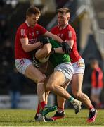 13 March 2022; Shane Walsh of Meath is tackled by Joe Grimes, left, and Kevin Flahive of Cork during the Allianz Football League Division 2 match between Meath and Cork at Páirc Táilteann in Navan, Meath. Photo by Brendan Moran/Sportsfile