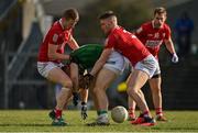 13 March 2022; Shane Walsh of Meath is tackled by Joe Grimes, left, and Kevin Flahive of Cork during the Allianz Football League Division 2 match between Meath and Cork at Páirc Táilteann in Navan, Meath. Photo by Brendan Moran/Sportsfile
