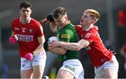 13 March 2022; Bryan McMahon of Meath is tackled by Paul Ring of Cork during the Allianz Football League Division 2 match between Meath and Cork at Páirc Táilteann in Navan, Meath. Photo by Brendan Moran/Sportsfile