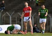 13 March 2022; Kieran Histon of Cork reacts after fouling Jason Scully of Meath, left, resulting in a penalty, celerated by Jordan Morris of Meath, right, during the Allianz Football League Division 2 match between Meath and Cork at Páirc Táilteann in Navan, Meath. Photo by Brendan Moran/Sportsfile
