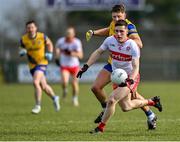 13 March 2022; Padraig McGrogan of Derry is tackled by Conor Cox of Roscommon during the Allianz Football League Division 2 match between Roscommon and Derry at Dr Hyde Park in Roscommon. Photo by Piaras Ó Mídheach/Sportsfile