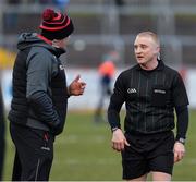 13 March 2022; Tyrone joint manager Feargal Logan in conversation with match referee Barry Cassidy after the Allianz Football League Division 1 match between Tyrone and Dublin at O'Neill's Healy Park in Omagh, Tyrone. Photo by Ray McManus/Sportsfile