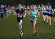 12 March 2022; Clodagh Gill of St Marys Ballina, Mayo, left, and Anna Watson of St Joseph of Cluny, Dublin, competing in the intermediate girls 3500m during the Irish Life Health All-Ireland Schools Cross Country at the City of Belfast Mallusk Playing Fields in Belfast. Photo by Ramsey Cardy/Sportsfile