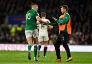 12 March 2022; Jack Carty, right, takes the kicking tee from Jonathan Sexton of Ireland during the Guinness Six Nations Rugby Championship match between England and Ireland at Twickenham Stadium in London, England. Photo by Brendan Moran/Sportsfile