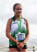 12 March 2022; Roise Roberts of Dominican College, Fortwilliam, Belfast, on the podium after finishing second in the senior girls 3500m during the Irish Life Health All-Ireland Schools Cross Country at the City of Belfast Mallusk Playing Fields in Belfast. Photo by Ramsey Cardy/Sportsfile
