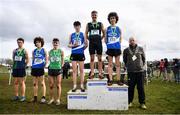 12 March 2022; On the podium after the senior boys 6500m race, are from left, Jonas Stafford of East Glendalough, Wicklow, Dylan Casey of St Flannans Ennis, Clare, Matthew Lavery of St Malachy's College, Belfast, Niall Murphy of St Flannans Ennis, Clare, Scott Fagan of  Castleknock CC, Dublin, and Dean Casey of St Flannans Ennis, Clare during the Irish Life Health All-Ireland Schools Cross Country at the City of Belfast Mallusk Playing Fields in Belfast. Photo by Ramsey Cardy/Sportsfile