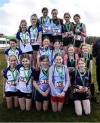 12 March 2022; On the podium after the minor girls race are, Our Lady & St Patrick's, Knock, Belfast, Presentation Kilkenny, and Colaiste Muire Ennis, Clare, during the Irish Life Health All-Ireland Schools Cross Country at the City of Belfast Mallusk Playing Fields in Belfast. Photo by Ramsey Cardy/Sportsfile