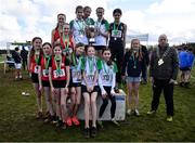 12 March 2022; On the podium after the junior girls race are, from left, St Aloysius Carrigtwohill, Cork, Sullivan Upper School, Holywood, Belfast, and Wallace High School, Lisburn, Antrim, during the Irish Life Health All-Ireland Schools Cross Country at the City of Belfast Mallusk Playing Fields in Belfast. Photo by Ramsey Cardy/Sportsfile
