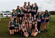 12 March 2022; On the podium after the inter girls race, are, Colaiste Muire Ennis, Clare, Sacred Heart Tullamore, Offaly, and St Marys Ballina, Mayo, during the Irish Life Health All-Ireland Schools Cross Country at the City of Belfast Mallusk Playing Fields in Belfast. Photo by Ramsey Cardy/Sportsfile