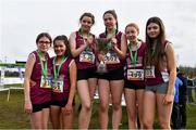 12 March 2022; On the podium after the inter girls race, are Sacred Heart Tullamore, Offaly, during the Irish Life Health All-Ireland Schools Cross Country at the City of Belfast Mallusk Playing Fields in Belfast. Photo by Ramsey Cardy/Sportsfile
