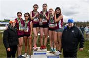 12 March 2022; On the podium after the inter girls race, are Sacred Heart Tullamore, Offaly, during the Irish Life Health All-Ireland Schools Cross Country at the City of Belfast Mallusk Playing Fields in Belfast. Photo by Ramsey Cardy/Sportsfile
