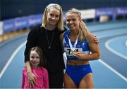 27 February 2022; Senior women's 60m champion and national record holder Molly Scott of St Laurence O'Toole AC, Carlow, right, with Olympian Derval O'Rourke, and her daughter Dafne O'Leary, during day two of the Irish Life Health National Senior Indoor Athletics Championships at the National Indoor Arena at the Sport Ireland Campus in Dublin. Photo by Sam Barnes/Sportsfile