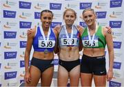 27 February 2022; Women's 1500m medallists, Georgie Hartigan of Dundrum South Dublin AC, Dublin, gold, Nadia Power of Dublin City Harriers AC, silver, and Carla Sweeney of Rathfarnham WSAF AC, Dublin, bronze, during day two of the Irish Life Health National Senior Indoor Athletics Championships at the National Indoor Arena at the Sport Ireland Campus in Dublin. Photo by Sam Barnes/Sportsfile