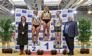 27 February 2022; Athletics Ireland President John Cronin, right, and Liz Rowen, Head of Marketing at Irish Life Health, left, with women's 400m medallists, Phil Healy of Bandon AC, Cork, gold, Sophie Becker of Raheny Shamrock AC, Dublin, silver, and Roisin Harrison of Emerald AC, Limerick, during day two of the Irish Life Health National Senior Indoor Athletics Championships at the National Indoor Arena at the Sport Ireland Campus in Dublin. Photo by Sam Barnes/Sportsfile