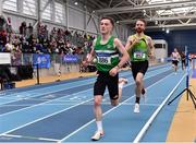 27 February 2022; Conor Maguire of Monaghan Phoenix AC, left, and Mitchell Byrne of Rathfarnham WSAF AC, Dublin, competing in the senior men's 3000m during day two of the Irish Life Health National Senior Indoor Athletics Championships at the National Indoor Arena at the Sport Ireland Campus in Dublin. Photo by Sam Barnes/Sportsfile