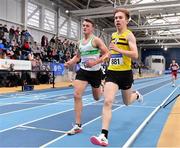 27 February 2022; Cathaoir Purvis of North Belfast Harriers, right, and Shane Spring of Raheny Shamrock AC, Dublin, competing in the senior men's 3000m during day two of the Irish Life Health National Senior Indoor Athletics Championships at the National Indoor Arena at the Sport Ireland Campus in Dublin. Photo by Sam Barnes/Sportsfile