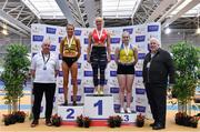27 February 2022; Athletics Ireland President John Cronin, right and Eamonn Flanagan, left, with Women's pole vault medallists, Ellen McCartney of City of Lisburn AC, Down, gold, Una Brice of Leevale AC, Cork, silver, and Clodagh Walsh of Abbey Striders AC, Cork, bronze,  during day two of the Irish Life Health National Senior Indoor Athletics Championships at the National Indoor Arena at the Sport Ireland Campus in Dublin. Photo by Sam Barnes/Sportsfile