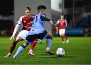 14 March 2022; Sean Brennan of UCD in action against Chris Forrester of St Patrick's Athletic during the SSE Airtricity League Premier Division match between St Patrick's Athletic and UCD at Richmond Park in Dublin. Photo by Piaras Ó Mídheach/Sportsfile